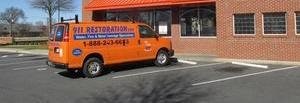 Water Damage Restoration Van Parked At Job