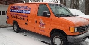 Water Damage Restoration Van At Winter Residential Job Site