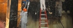 Water Damage Restoration Technicians Inspecting Water Leaks