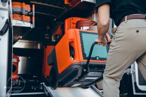 water damage restoration equipment loaded into van